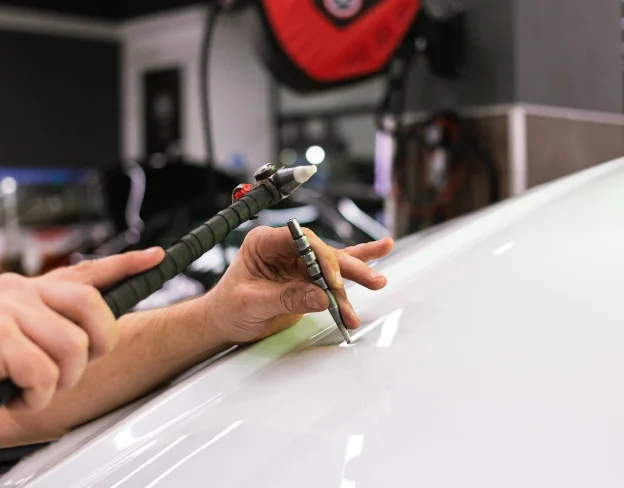 Elimination d'impact sur carrosserie au Garage Doc Auto à Beauchamp près d'Argenteuil - Val d'Oise (95)